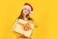 small girl santa at yellow background. xmas party celebration. happy new year. christmas shopping online. time for Royalty Free Stock Photo