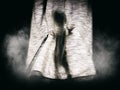 Small Girl Silhouette Behind Dark Curtain Royalty Free Stock Photo