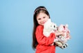 Small girl with soft bear toy. child psychology little girl play game in playroom. happy childhood. Birthday. hugging Royalty Free Stock Photo