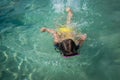 Small girl in a swimming mask swim in clean turquoise water Royalty Free Stock Photo