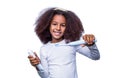Small girl, toothbrush. Multiracial girl brushes her teeth an electric toothbrush. Little girl toothbrush closeup Royalty Free Stock Photo