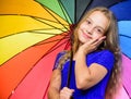 Small girl with umbrella in rainy weather. Happy little girl with umbrella. Feeling protected at this autumn day. Happy