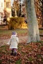 Small girl walking in a park