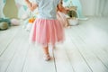 Small girl is walking on the wooden floor close up Royalty Free Stock Photo