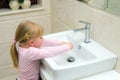 Girl washing her hands