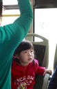 Small girl watching tv on the bus