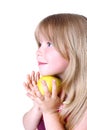 Small girl with yellow apple Royalty Free Stock Photo