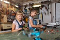 Young girls building toy construction machine Royalty Free Stock Photo