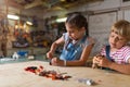 Young girls building toy construction machine Royalty Free Stock Photo