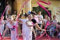 Enchanting Rhythms: Small Girls Illuminate the Stage with Colorful Ribbons on World Day of Dance