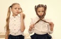 Small girls with tail hairdo. Children need new hairdo in hair salon. small girls back to school