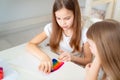 Small girls write stay home. flashmob. rainbow Royalty Free Stock Photo