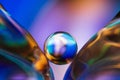 Small glass ball in abstract macro composition. Royalty Free Stock Photo