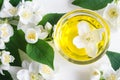 Small glass bowl with cosmetic/massage/cleansing jasmine aroma oil. Royalty Free Stock Photo