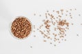 A small glass of buckwheat - traditional Russian meal - on white background