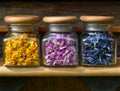 Small glass jars with colored flowers