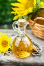 A small glass jug with fresh sunflower oil.