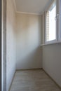 Small glazed balcony in the apartment of a residential building