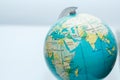 Small globe, focus on Asia, the Middle East and East Africa.