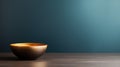 A small gold bowl sitting on a wooden table against blue wall, AI