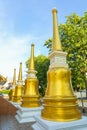 Small gold pagoda in row with blue sky background Royalty Free Stock Photo