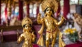 Small gold statue of Krishna, at a Hare Krishna Royalty Free Stock Photo