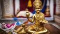 Small gold statue of Krishna, at a Hare Krishna Royalty Free Stock Photo