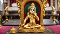 Small gold statue of Krishna, at a Hare Krishna Royalty Free Stock Photo