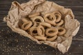 Small golden bagels in craft paper