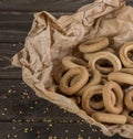 Small golden bagels in craft paper