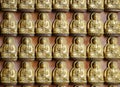 Small Golden chinese style buddha sculpture at Wat Borom Raja Kanchanapisek Anusorn