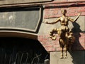 Small golden statue of Enea on a wall to Tbilisi in Georgia.