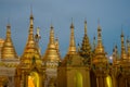 Small golden stupas of the Shwedagon Pagoda in the evening twilight, Yangon