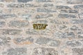 Small golden symbol on street pavement placed by Network of Jewish Quarters of Spain. Plaque marks the former Jewish Quarter. The