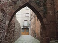 Small gothic entrance portal to the red village of prades, Royalty Free Stock Photo