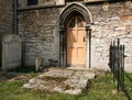 Small, gothic type church door which is located near the crypt of the old church.