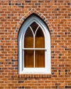 Small Gothic Window in Red Brick Wall Royalty Free Stock Photo