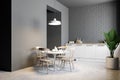 Small gray brick kitchen and dining room corner