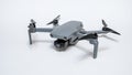 Small gray folding quadcopter with three-axis gimbal camera