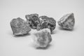 Small gray-white stones group on white background,Light and shadow under the rock, Five rocks