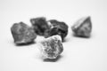 Small gray-white stones group on blurred stone background,Light and shadow under the rock, Five rocks on white background