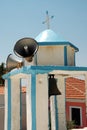 Small Greek bell tower with loudspeakers Royalty Free Stock Photo