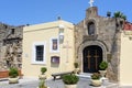 Small Greek church mounted in wall of old fortress in Rhodes town on Rhodes island Royalty Free Stock Photo