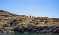 Small chapel, Greek Church on the rocky hill by the sea, blue sky background. Kythnos island, Greece Royalty Free Stock Photo