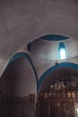 Small Greek Orthodox chapel on Mykonos with a light beam coming through.