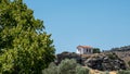 Small Greek Orthodox church on a rocky hill Royalty Free Stock Photo