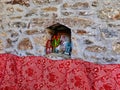Small Greek Orthodox Icons in Small Nook in Stone Wall, Greece Royalty Free Stock Photo