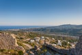 Small Greek Village sea and mountains landscape from old castle ruins in Greece Royalty Free Stock Photo