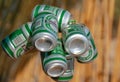 Small green cans of Heineken beer.