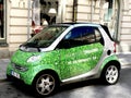 Small green car parked at a street Royalty Free Stock Photo